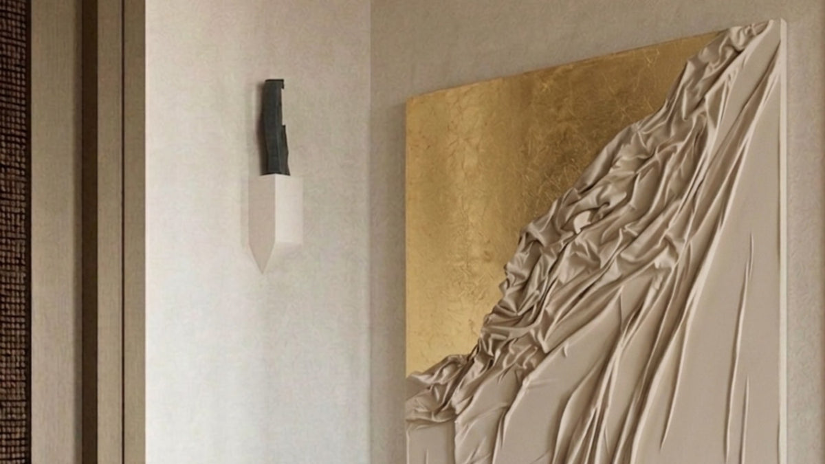 Handmade gold-leaf textured canvas art hanging above a console bench
